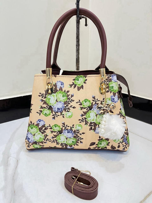 Elegant Floral Pattern Handbag with Stylish Handle and Charm Accent